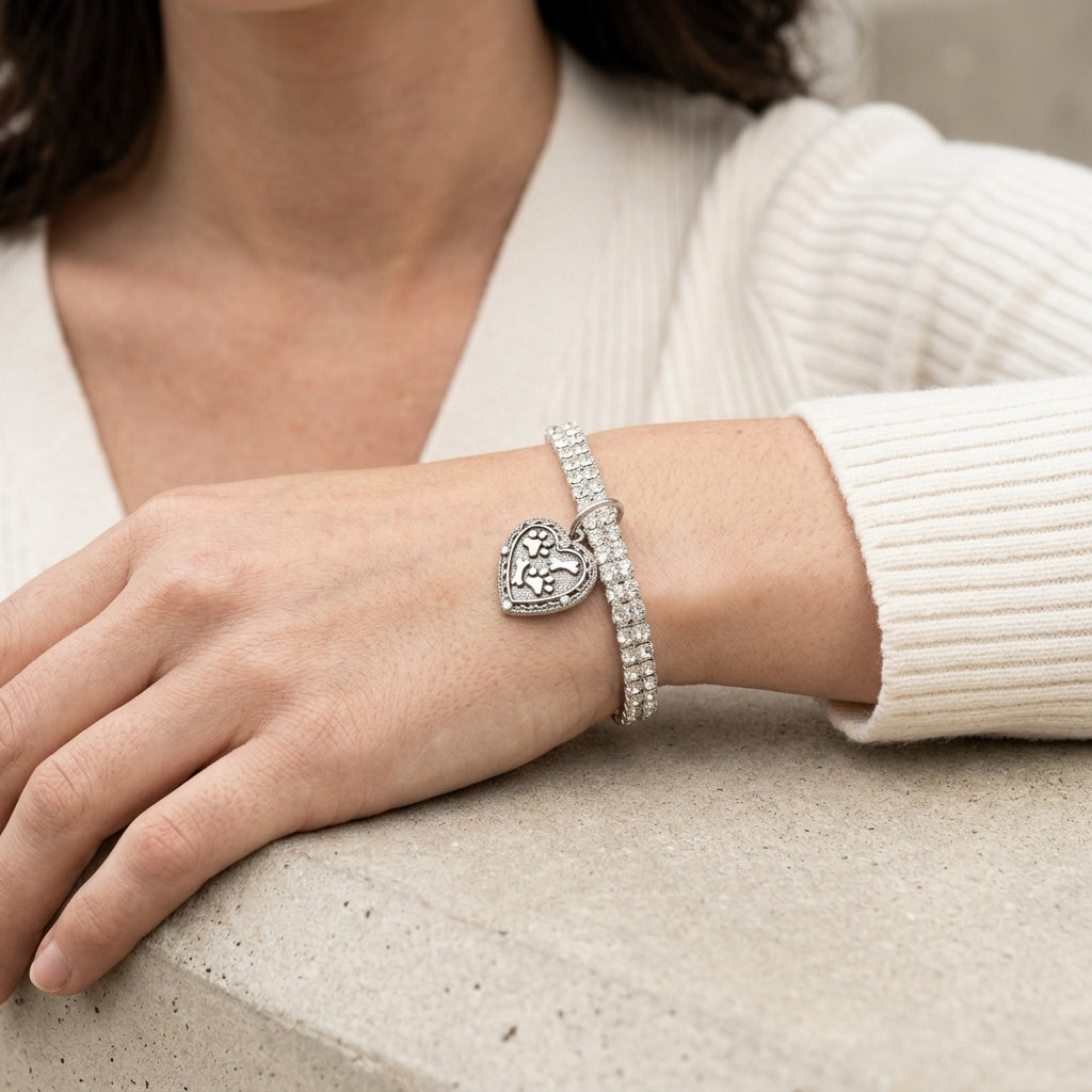 Woman wearing a Two Row Rhinestone Crystal Stretch Bracelet With Paws And Bones Heart Charm