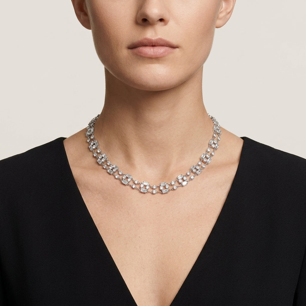 Woman wearing a sparkling Austrian crystal necklace with baguette-shaped design against a neutral background
