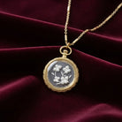 Round German Carved Intaglio Glass Flower Pendant Necklace on dark red fabric