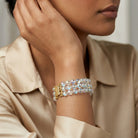 Model posing her wrist to showcase our Round Three Row AB Glass Beaded Bracelet