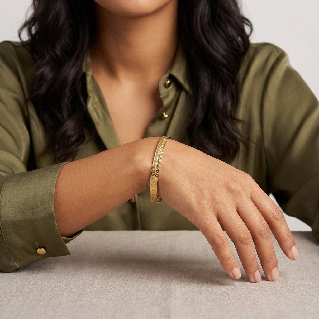 Woman wearing a Gold Classic Leaf Bangle Bracelet