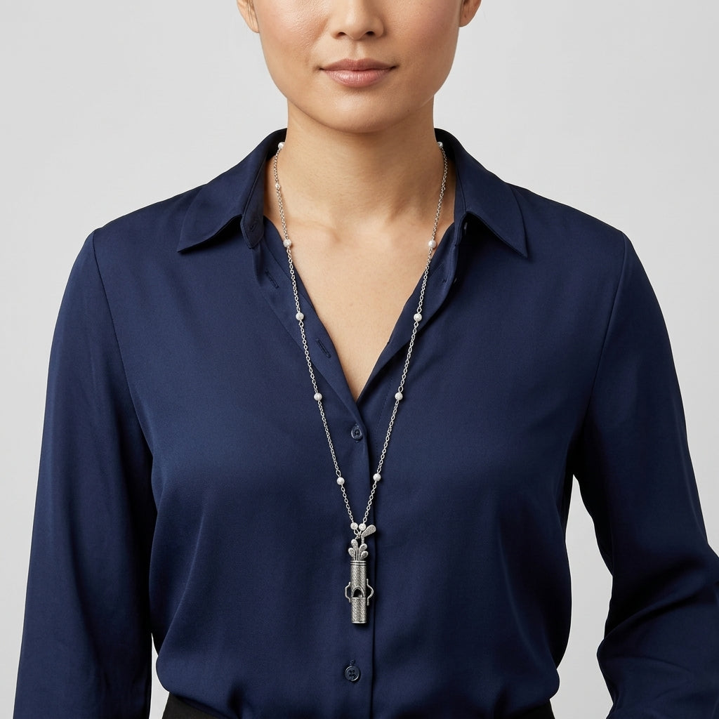 Woman in a blue collared shirt wearing our Golf Club Set Whistle Pendant Faux Pearl Necklace