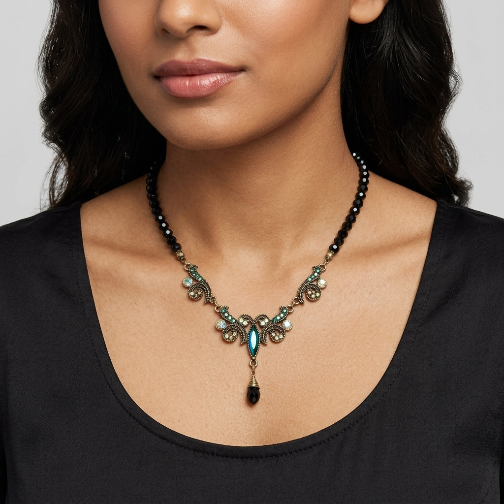 Woman in a dark top wearing one our Peacock Plumage Black Beaded Art Nouveau Style Multi AB Glass Stone Drop Pendant necklaces