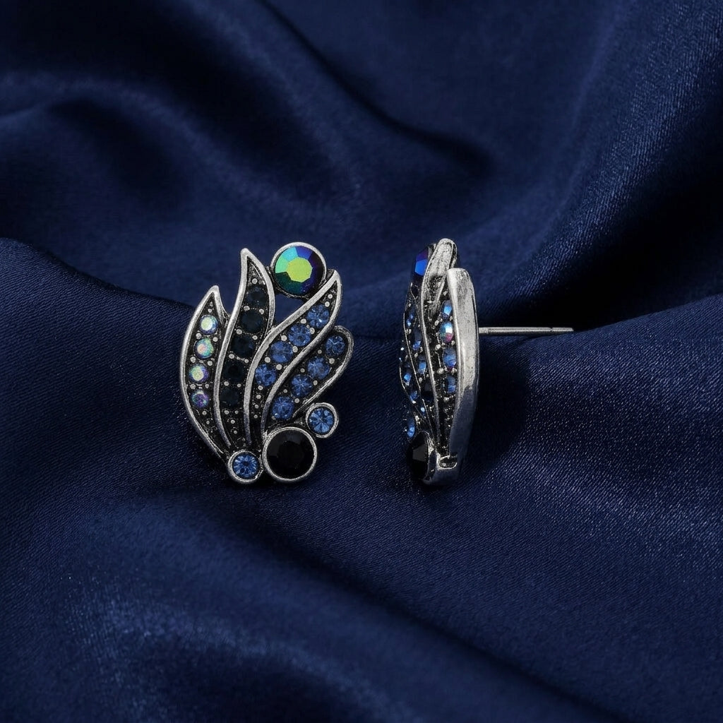 Giovane Iridescent AB Crystal & Blue Stone Post Earrings on navy fabric