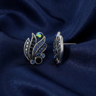 Giovane Iridescent AB Crystal & Blue Stone Post Earrings on navy fabric