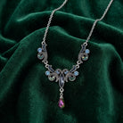 Elegant necklace with AB crystals on a green velvet background