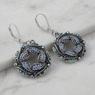 Giovane Iridescent AB Crystal & Blue Stone Wreath Drop Earrings
on a marble surface