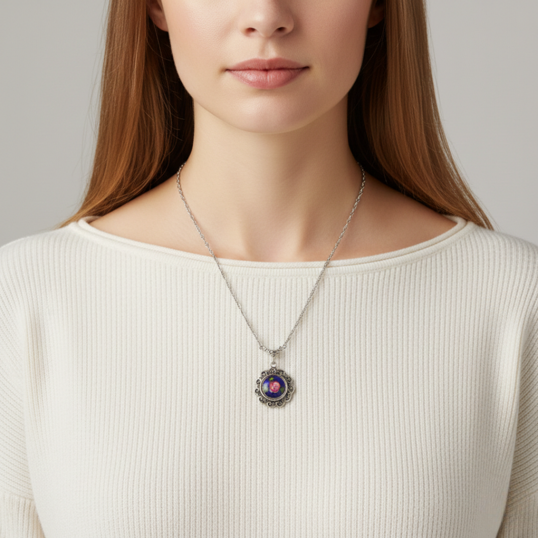 Woman wearing a necklace with a floral pendant against a neutral background