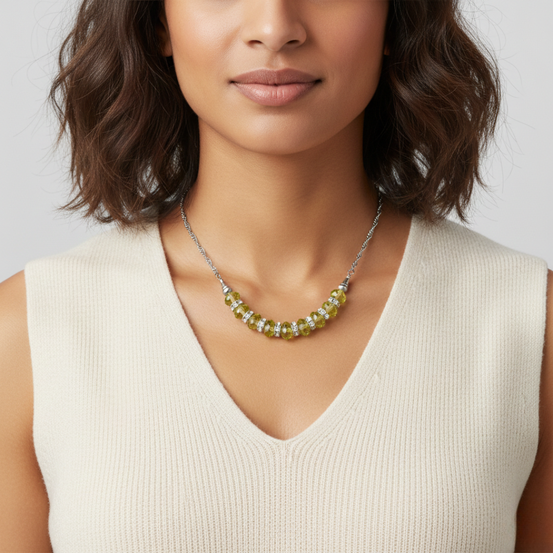 Woman wearing a necklace with a neutral background