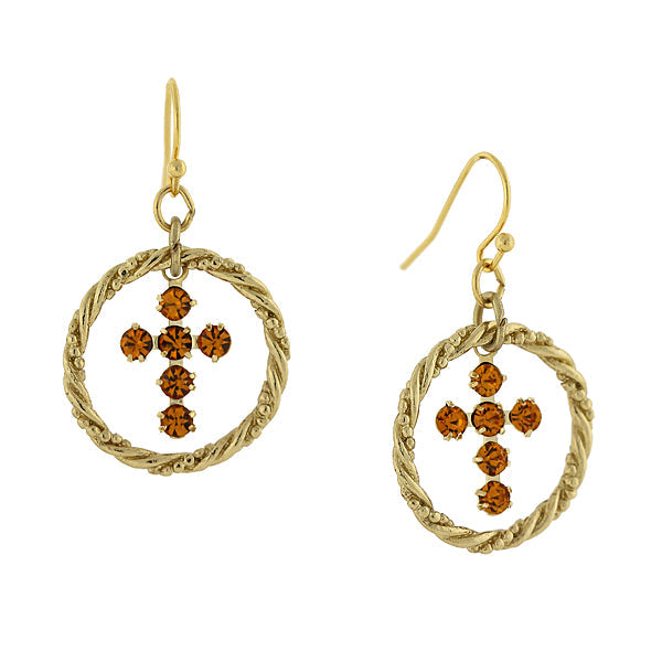 Gold earrings with circular designs and brown gemstones on a white background
