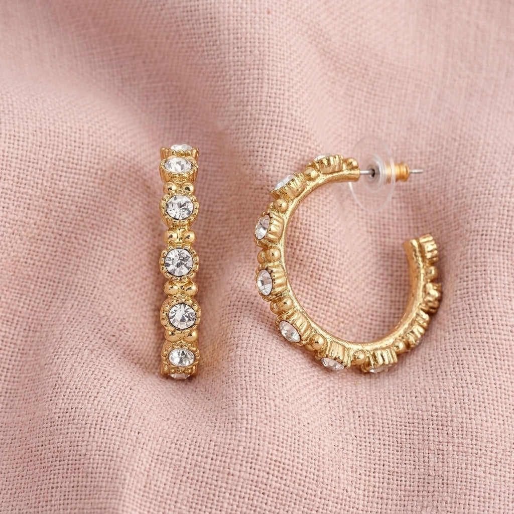 Clear Crystal Half Hoop Earrings on light pink linen