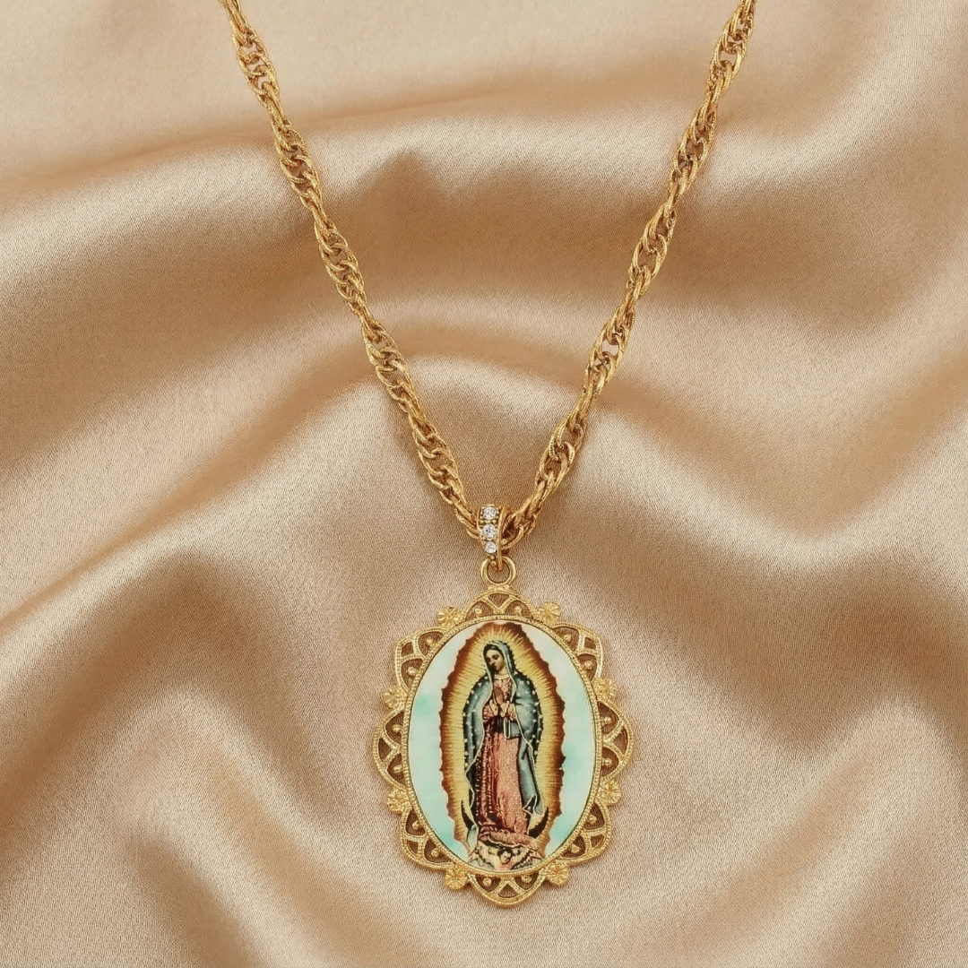 Gold necklace with a religious pendant on a beige fabric background