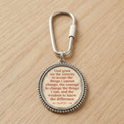 Keychain with The Serenity Prayer on a wooden surface