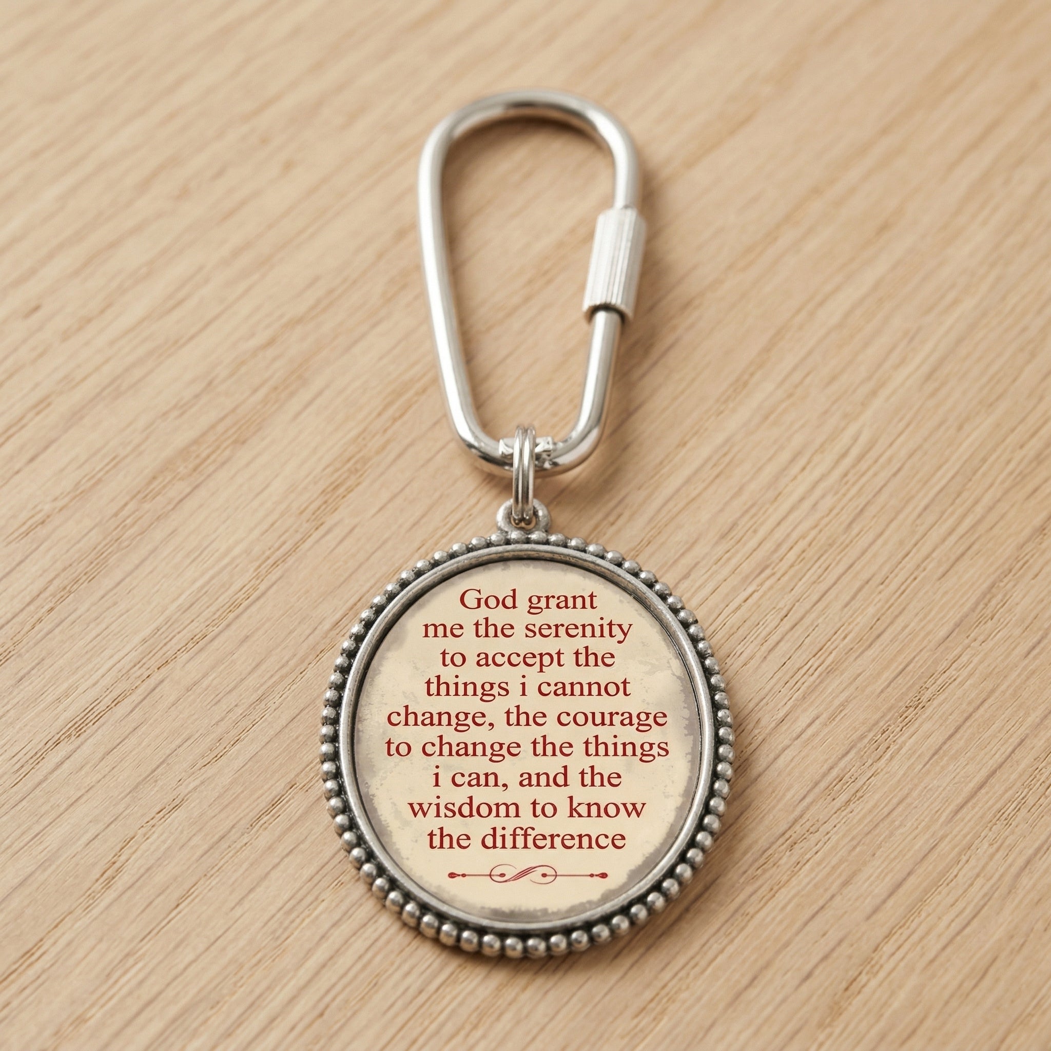 Keychain with The Serenity Prayer on a wooden surface