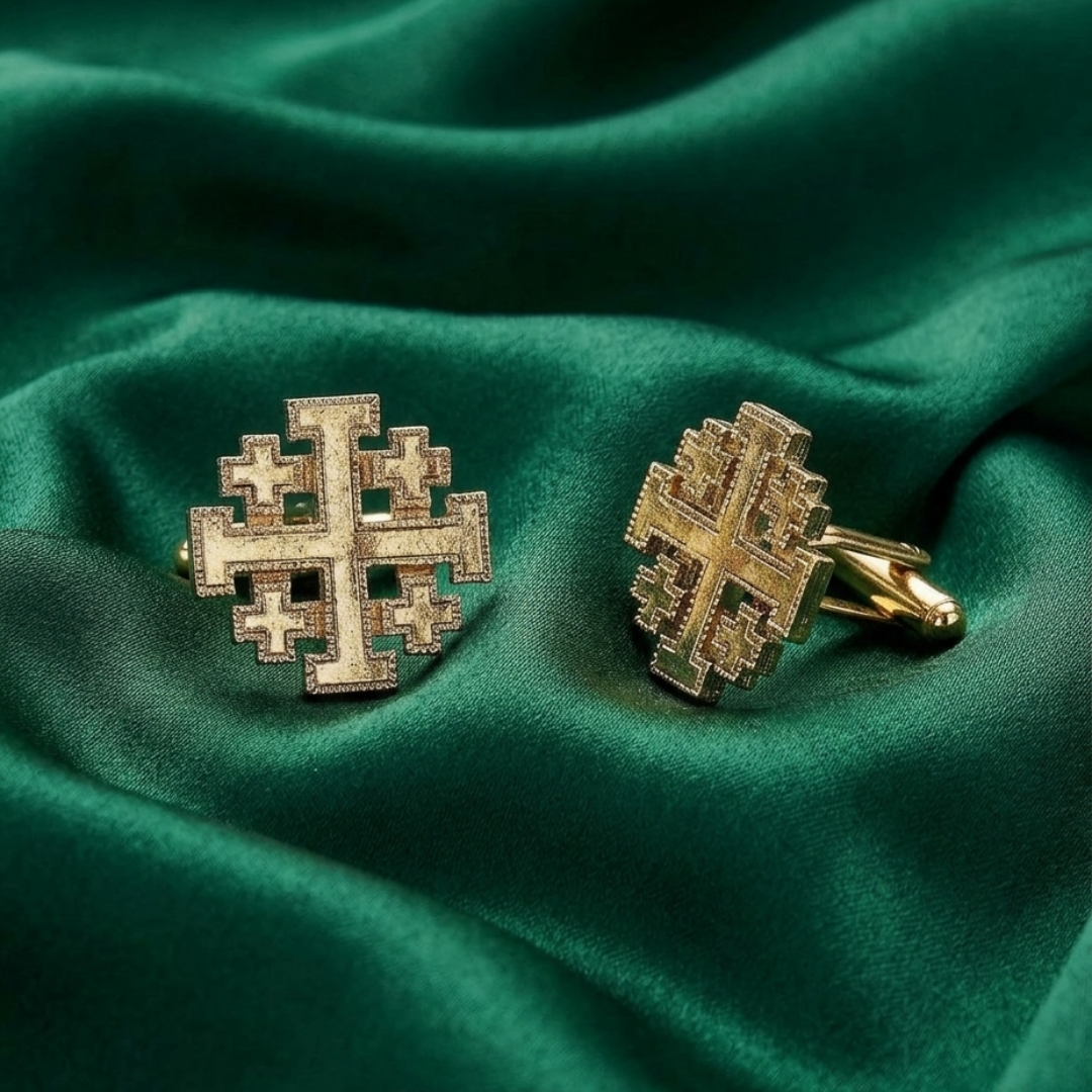 Gold Jerusalem Cross cufflinks on a green fabric background