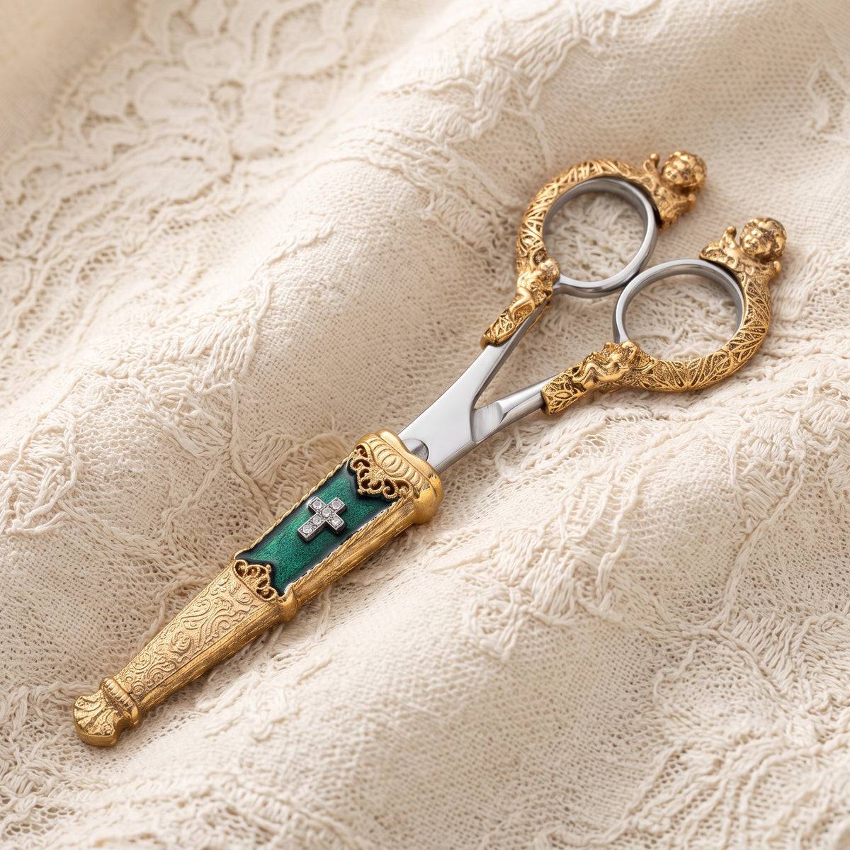Crystal Cross and Green Enamel Scissor Holder With Scissors, photographed on cream lace fabric.