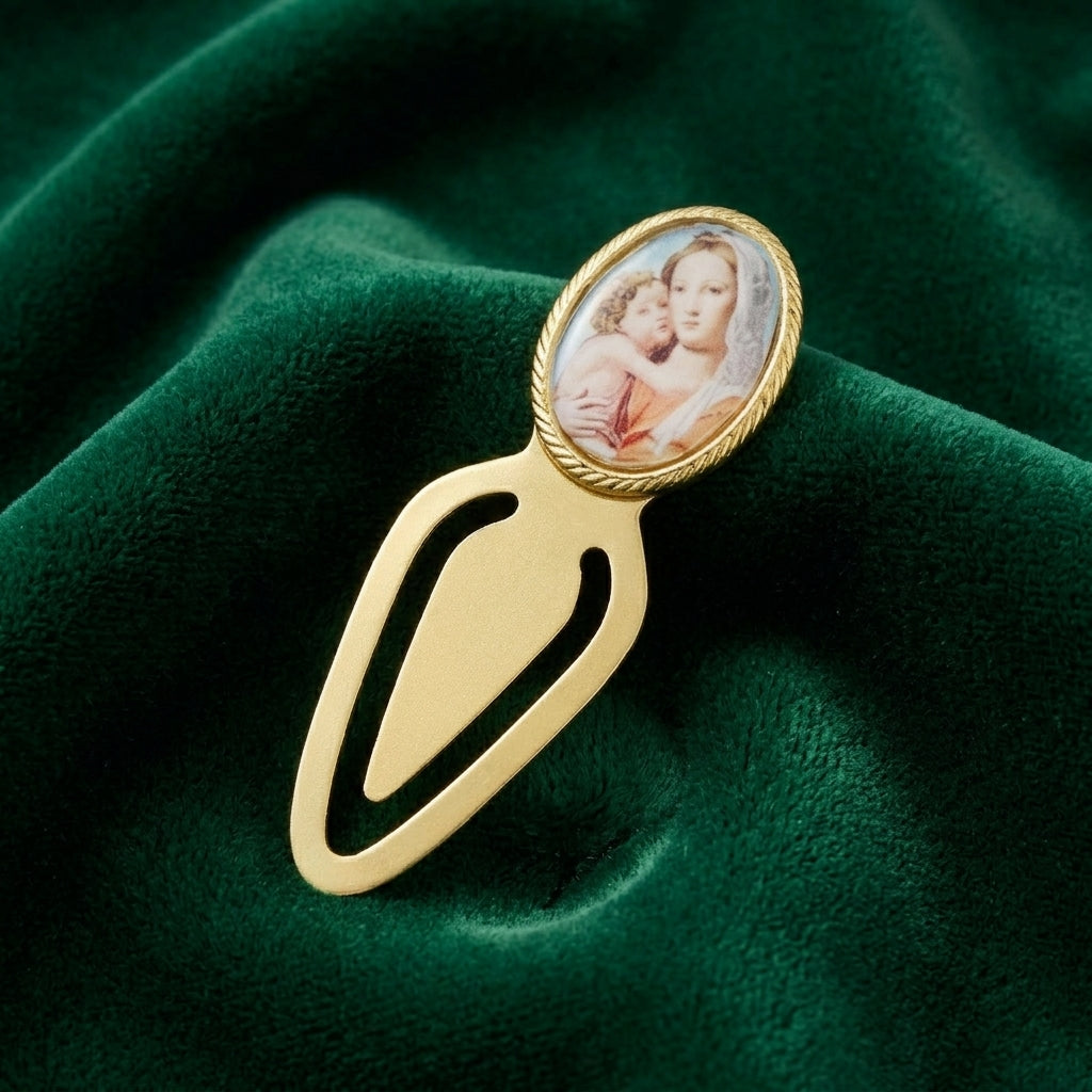 Gold tone bookmark with a portrait of Mother Mary and Child on a green fabric background