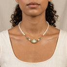 Woman wearing Aqua & Ivory Mother And Child Cameo Faux Pearl Strand Necklace