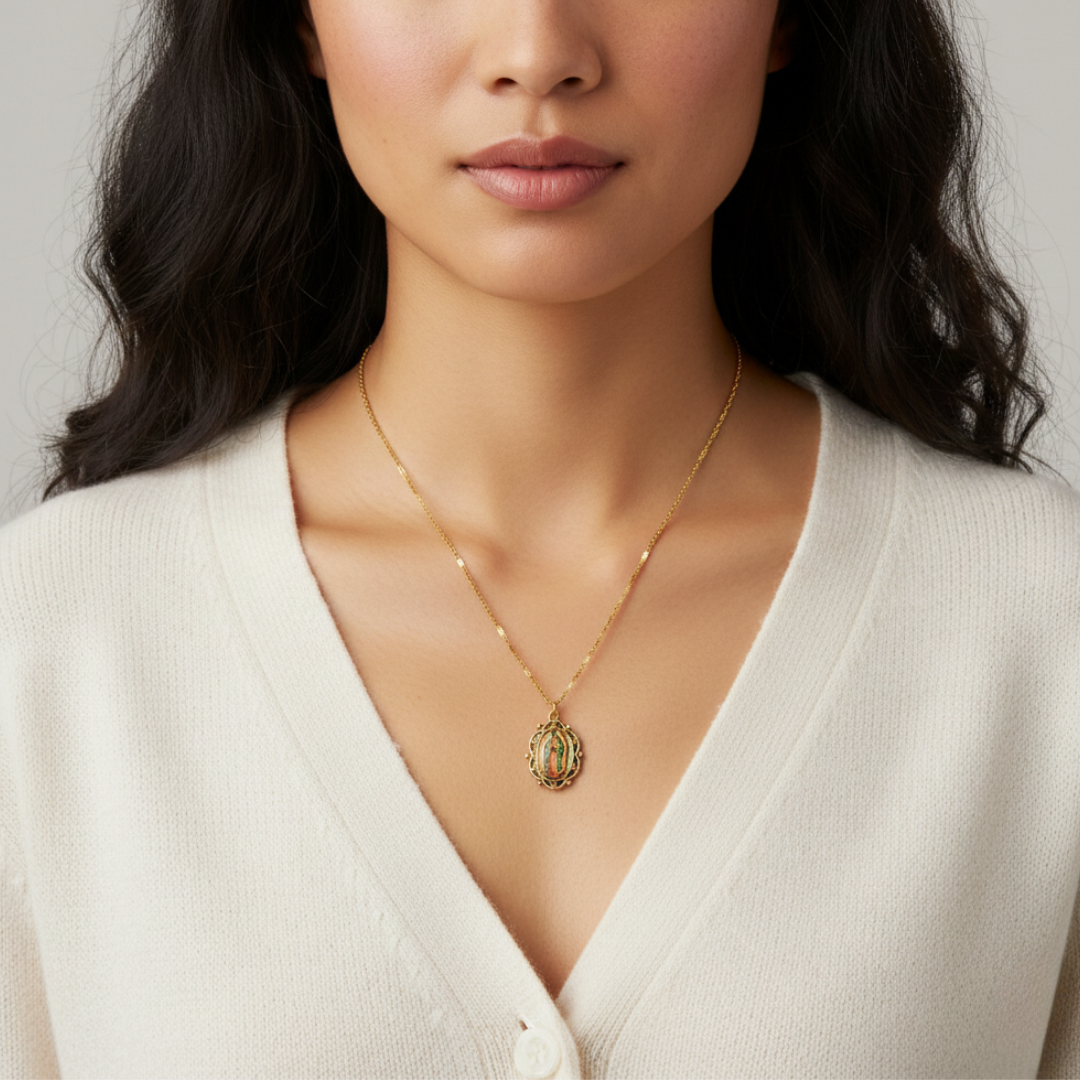 Woman wearing a gold necklace with a pendant against a neutral background
