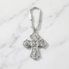 Silver holy family keychain on marble