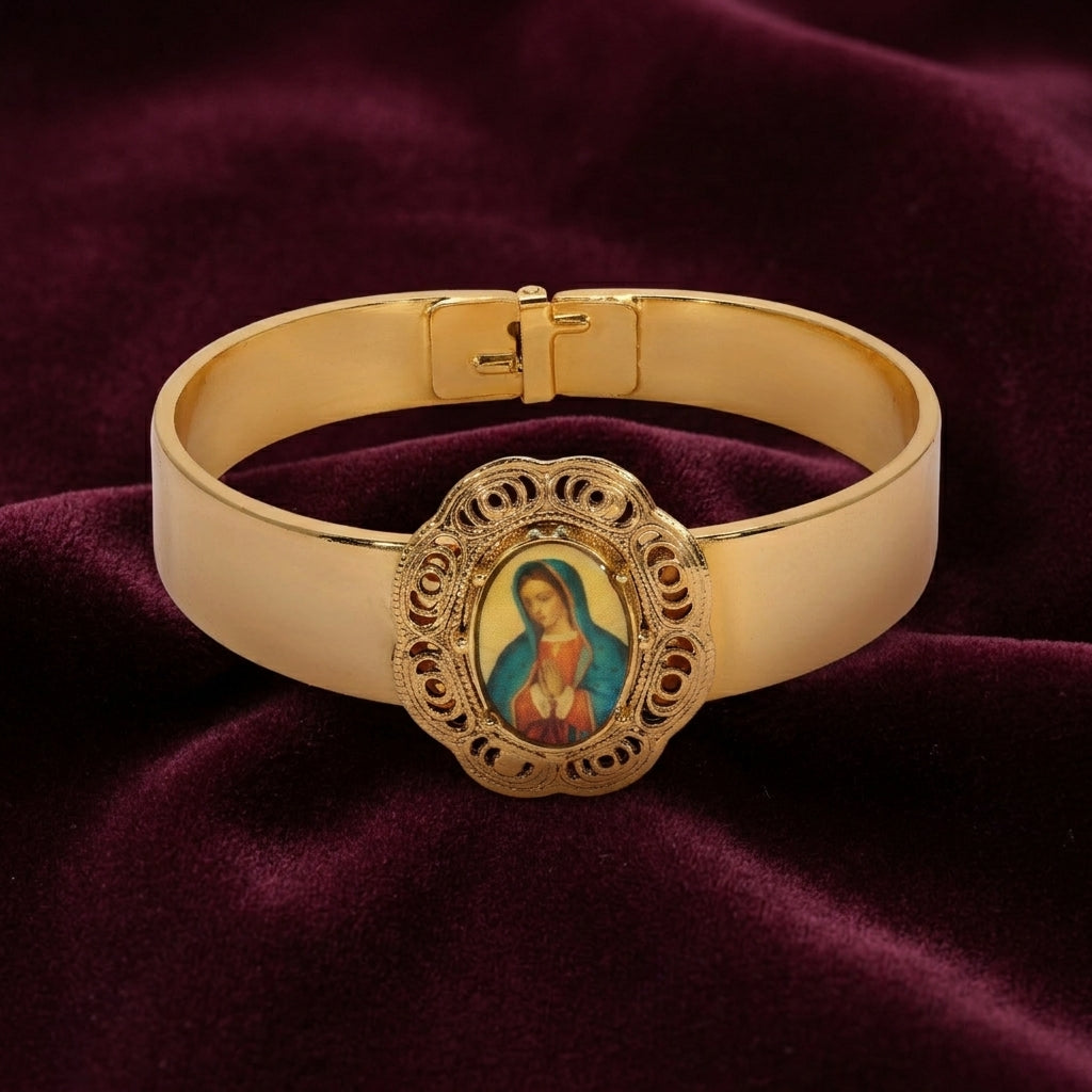 Gold bracelet with a religious icon on a purple fabric background
