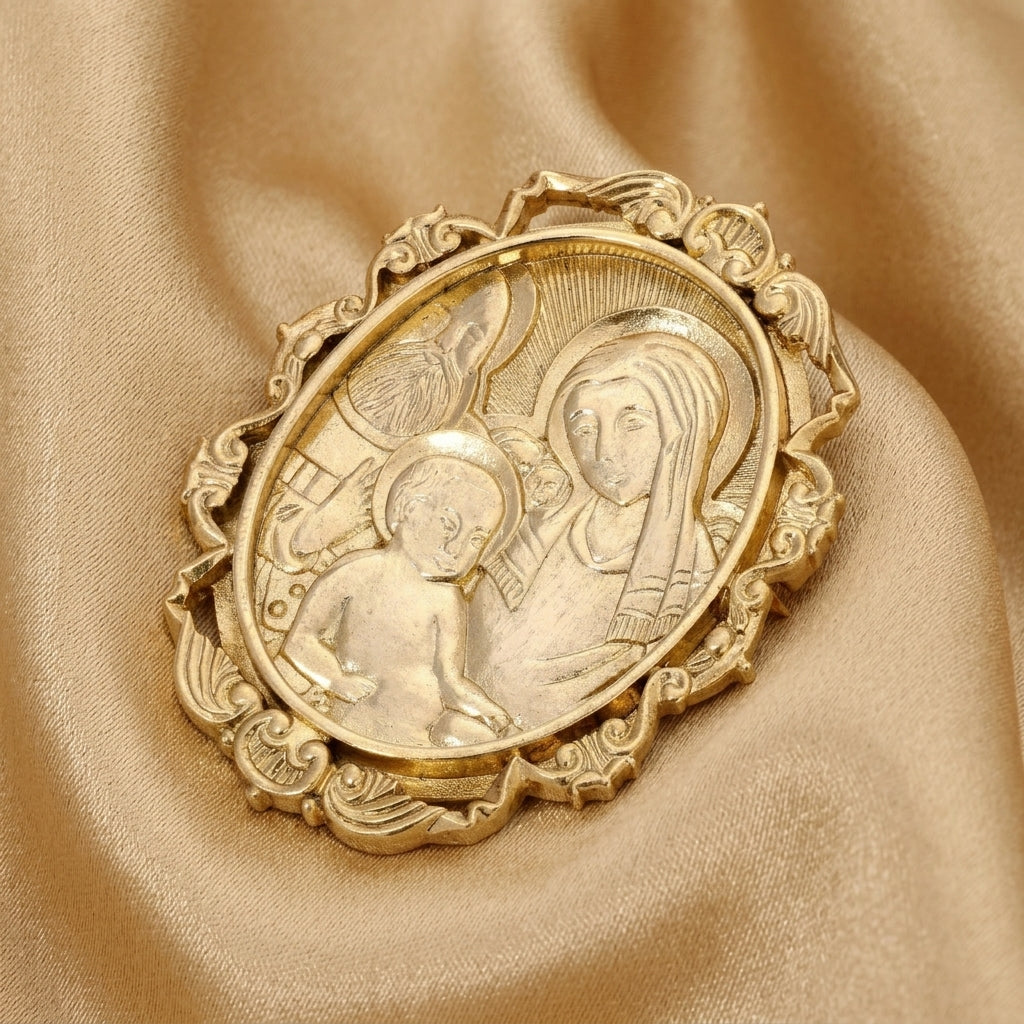 Gold religious brooch on a beige fabric background