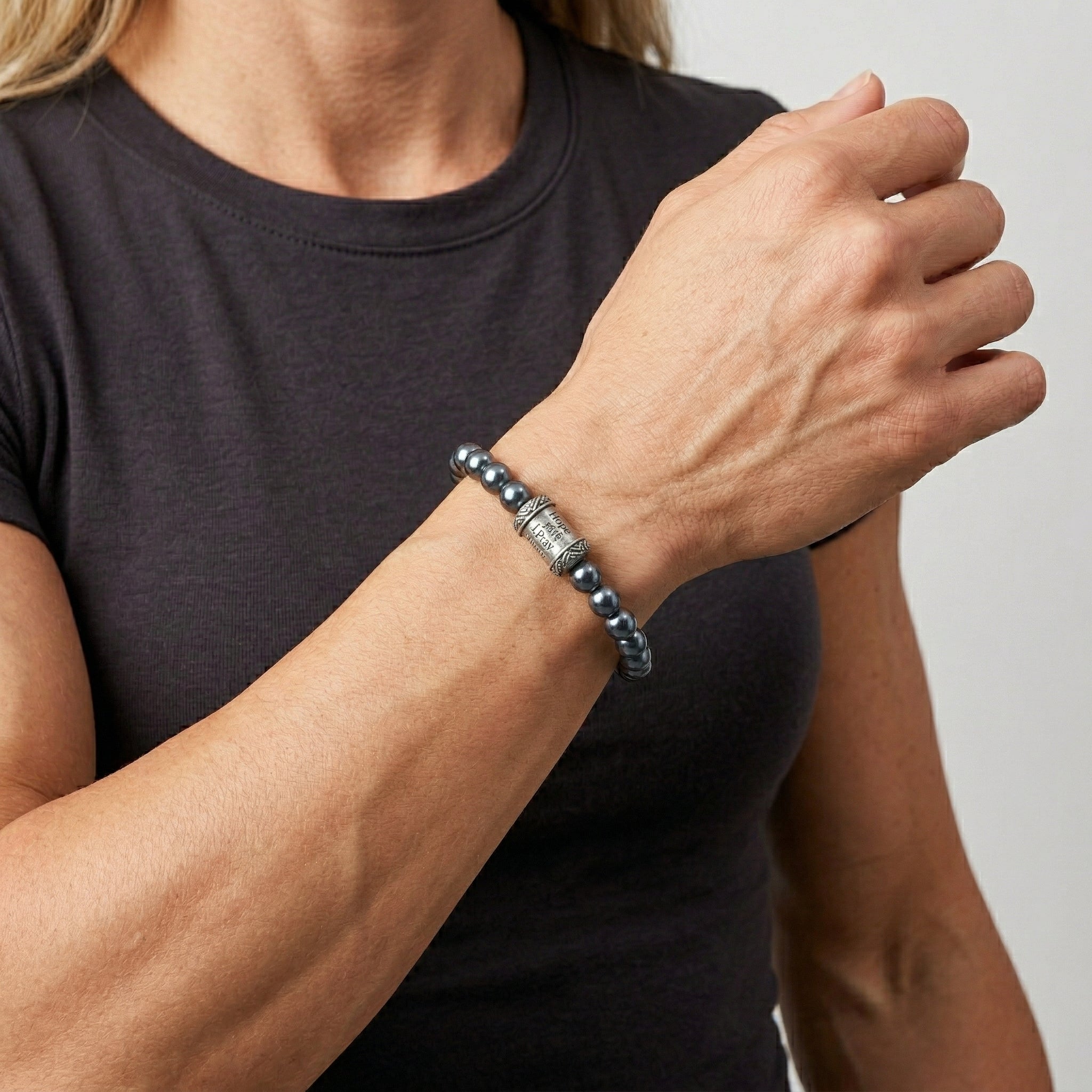 Woman wearing our Black Faux Pearl & Prayer Bead Bracelet