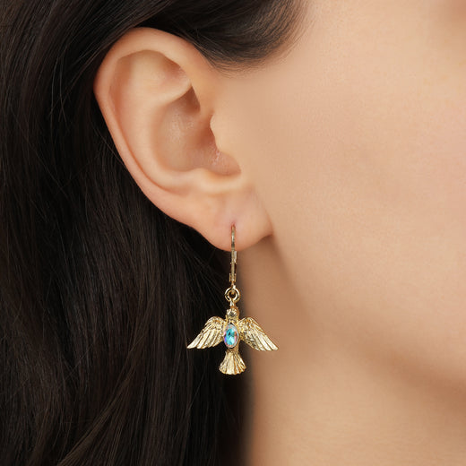 Close up of a woman wearing Gold AB Crystal Dove Drop Earrings