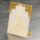 Decorative plaque with gold frame and embossed design of Mother Mary and Angels on a gray background