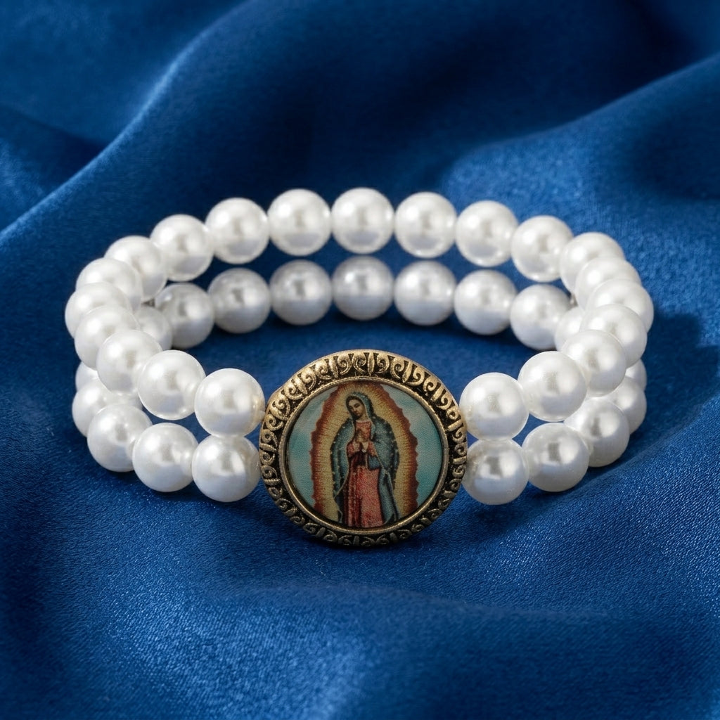 Pearl bracelet with a religious icon Lady of Guadalupe decal on a blue fabric background